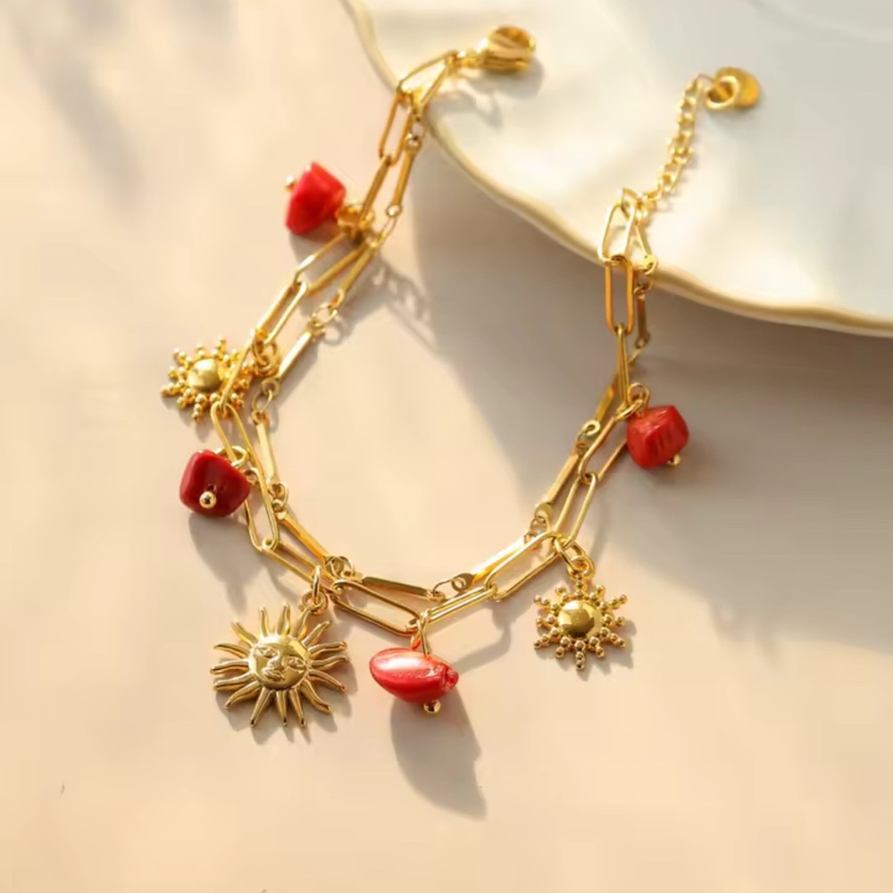Radiant Gold Bracelet with Red Sun Charms